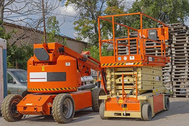 forklift moving inventory in warehouse setting in Elberon