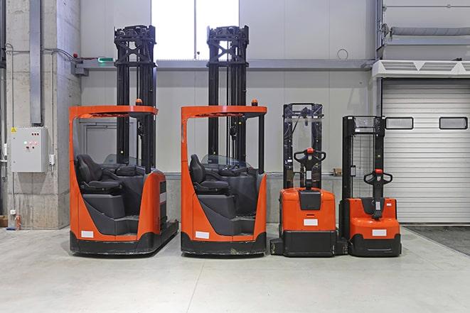 workers operating forklifts